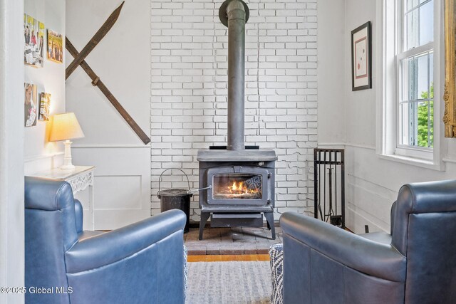 378 County Route 354, Rensselaerville, NY 12469 - living area with a wood stove and wood finished floors