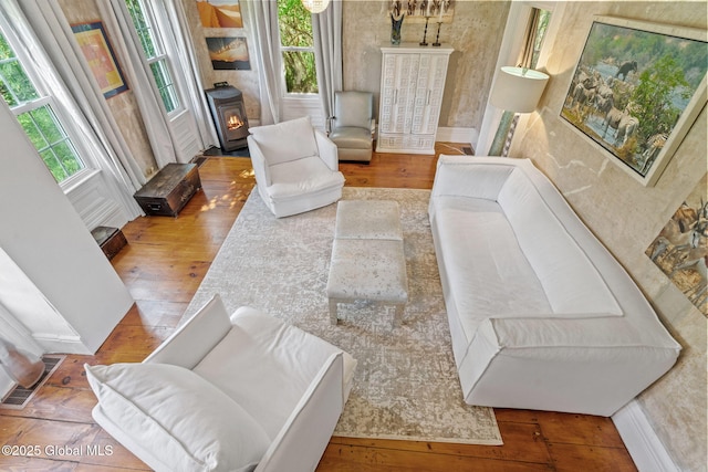 378 County Route 354, Rensselaerville, NY 12469 - living room featuring hardwood / wood-style floors and a wood stove
