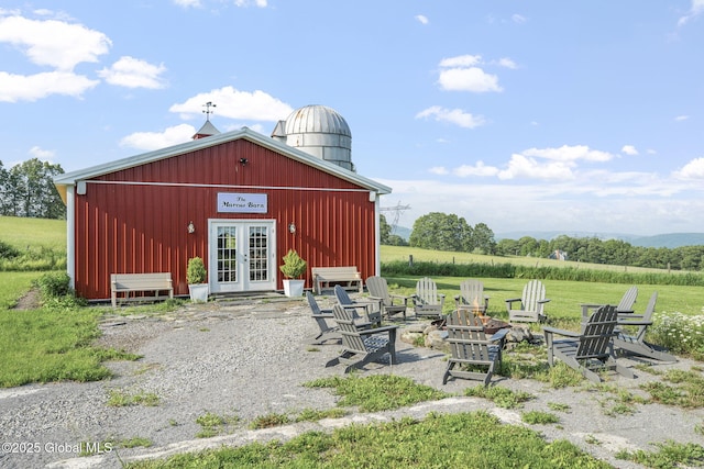 378 County Route 354, Rensselaerville, NY 12469 - view of outbuilding featuring french doors and an outdoor fire pit