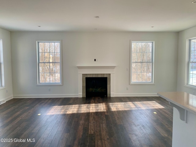LOT17 Windrow Way, Halfmoon, NY 12118 - unfurnished living room featuring dark wood-style flooring and a tile fireplace