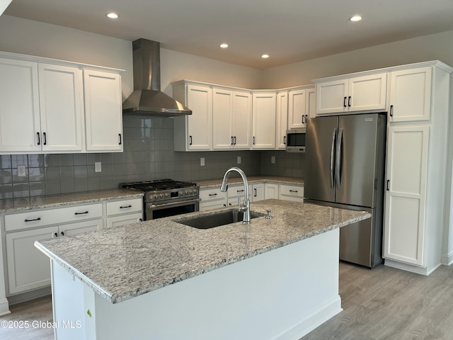 LOT17 Windrow Way, Halfmoon, NY 12118 - kitchen featuring stainless steel appliances, wall chimney range hood, light wood finished floors, white cabinetry, and recessed lighting
