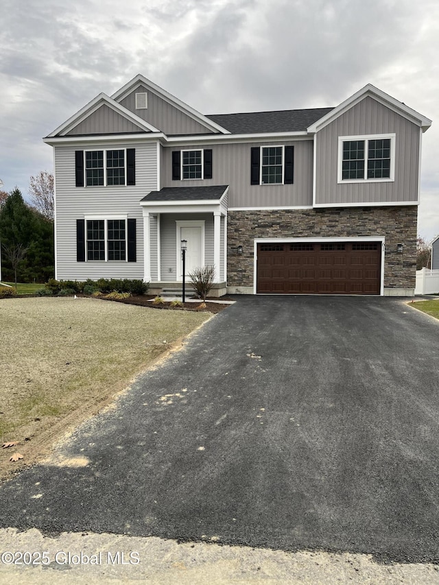 LOT17 Windrow Way, Halfmoon, NY 12118 - view of front of home with an attached garage, driveway, stone siding, and board and batten siding