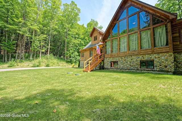236 Colfax Rd, Jackson, NY 12816 - view of home's exterior featuring stairway, a yard, and stone siding