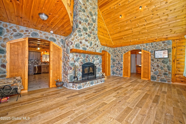 236 Colfax Rd, Jackson, NY 12816 - unfurnished living room with arched walkways, wood finished floors, wood ceiling, and high vaulted ceiling
