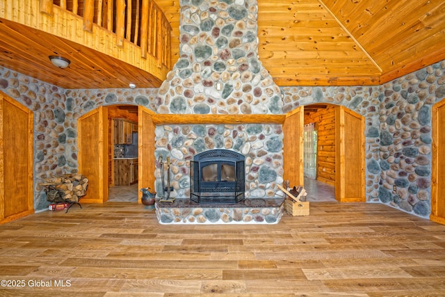 236 Colfax Rd, Jackson, NY 12816 - unfurnished living room featuring wooden ceiling, wood finished floors, high vaulted ceiling, and a stone fireplace