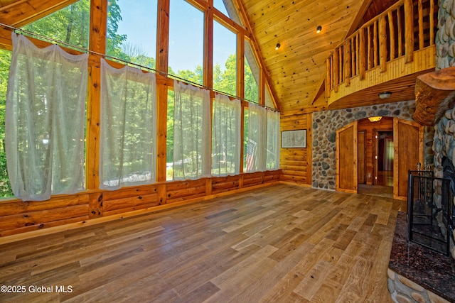 236 Colfax Rd, Jackson, NY 12816 - unfurnished living room with high vaulted ceiling, wood finished floors, arched walkways, and wood ceiling