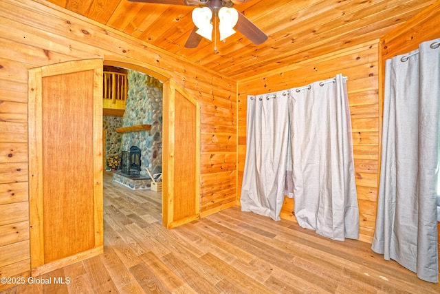 236 Colfax Rd, Jackson, NY 12816 - spare room featuring ceiling fan, wood finished floors, wood ceiling, wood walls, and arched walkways