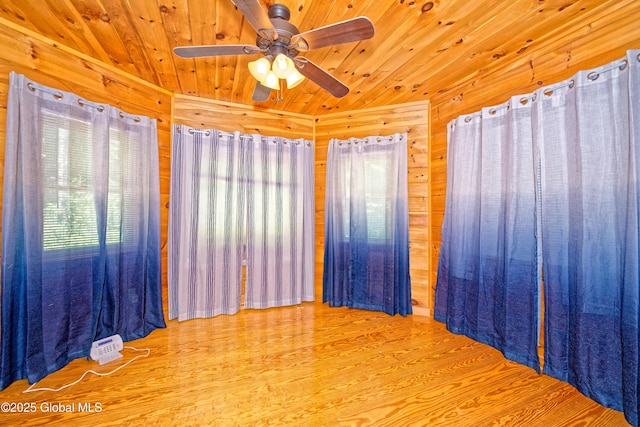 236 Colfax Rd, Jackson, NY 12816 - empty room with wooden walls, wood finished floors, ceiling fan, and wood ceiling