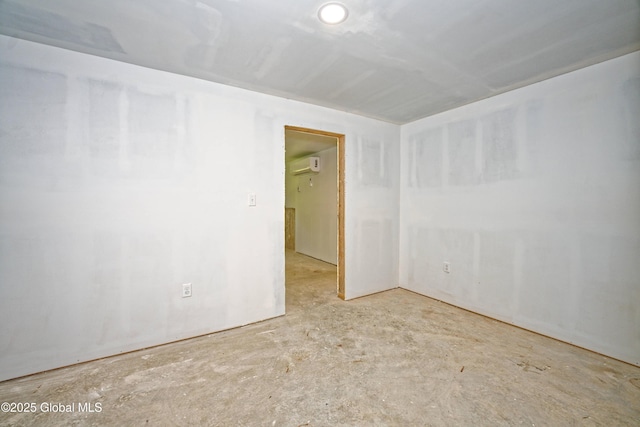 236 Colfax Rd, Jackson, NY 12816 - empty room featuring a wall mounted air conditioner and unfinished concrete floors