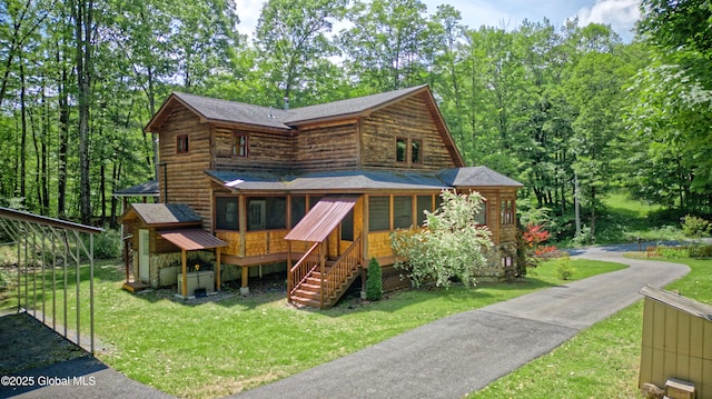 236 Colfax Rd, Jackson, NY 12816 - log cabin featuring a front yard, roof with shingles, and stairs