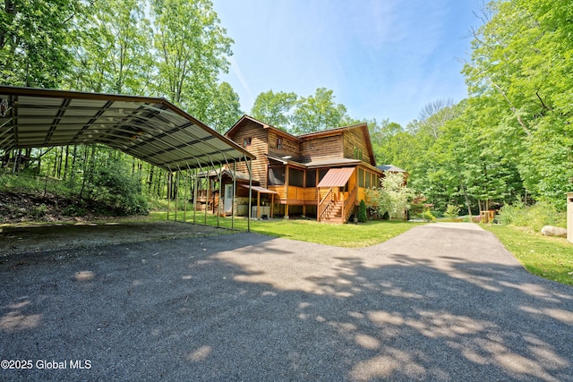 236 Colfax Rd, Jackson, NY 12816 - view of front of home with a carport, asphalt driveway, and a front yard