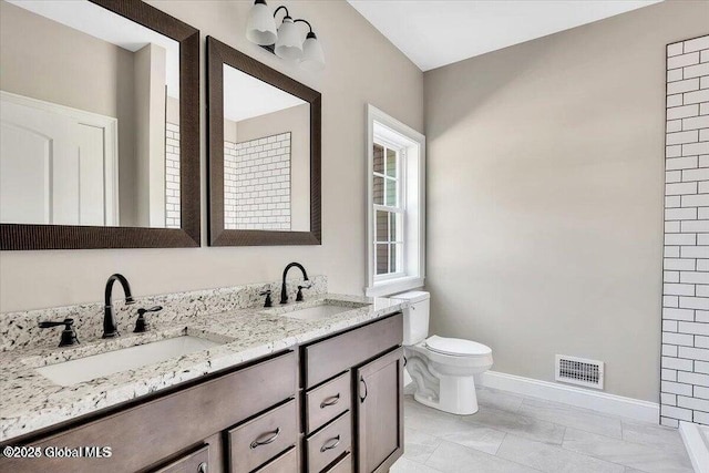 16 Surcingle Rd, Queensbury, NY 12804 - bathroom with double vanity and toilet