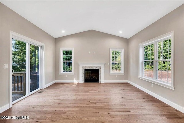 16 Surcingle Rd, Queensbury, NY 12804 - unfurnished living room with lofted ceiling, wood finished floors, a fireplace, and recessed lighting