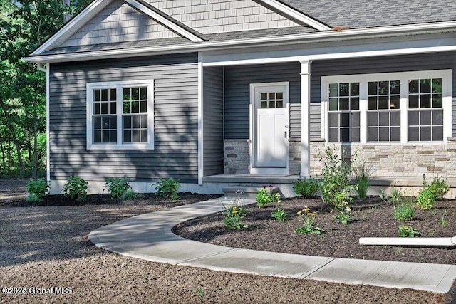 16 Surcingle Rd, Queensbury, NY 12804 - doorway to property featuring stone siding and a porch