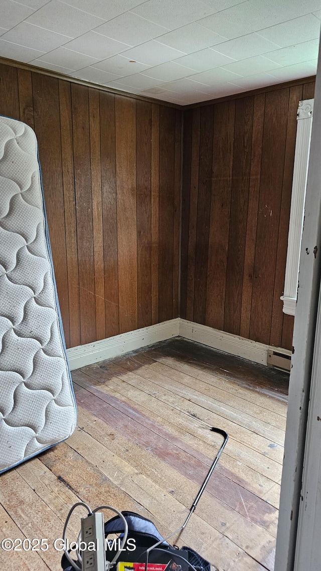 8 Main St, Hudson Falls, NY 12839 - unfurnished room with hardwood / wood-style flooring and wood walls