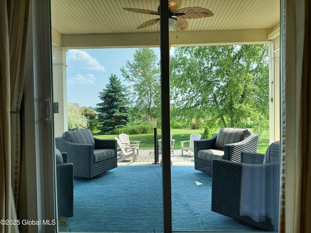 20 Beekman Pl, Queensbury, NY 12804 - view of patio featuring a ceiling fan and view of wooded area
