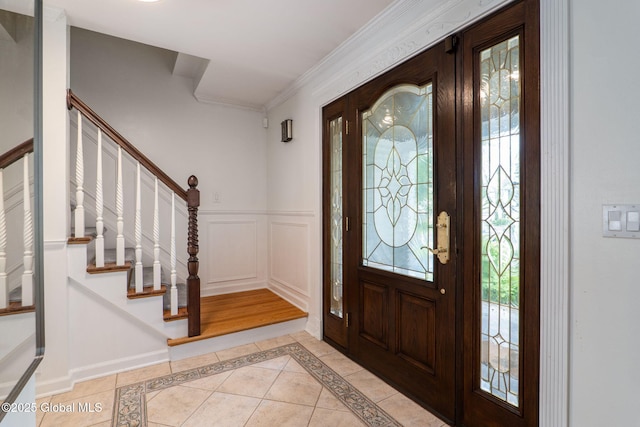 11 Boylston Dr, Bethlehem, NY 12054 - foyer featuring stairway, inlaid floor details, crown molding, a wainscoted wall, and light tile patterned flooring