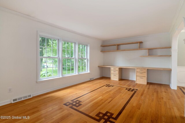 11 Boylston Dr, Bethlehem, NY 12054 - unfurnished office featuring crown molding, built in study area, light wood-type flooring, and arched walkways