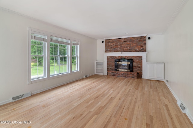 11 Boylston Dr, Bethlehem, NY 12054 - unfurnished living room featuring wood finished floors, crown molding, and a fireplace