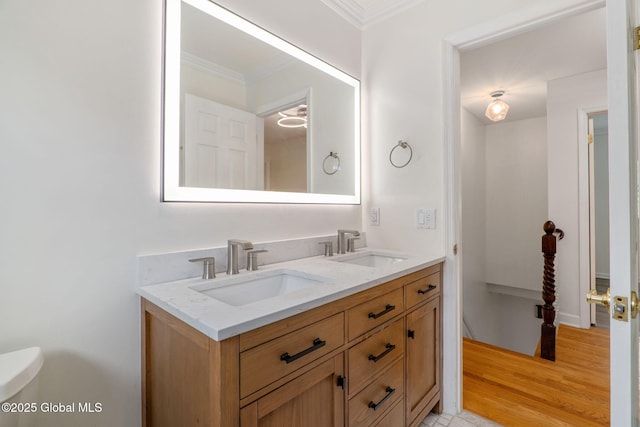 11 Boylston Dr, Bethlehem, NY 12054 - bathroom with ornamental molding, double vanity, and wood finished floors