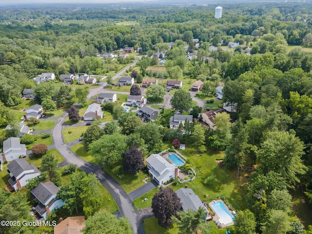 11 Boylston Dr, Bethlehem, NY 12054 - aerial perspective of suburban area with a heavily wooded area and a pool