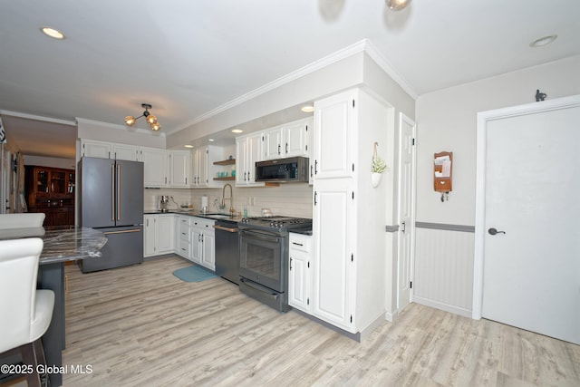 1038 Horvath St, Schenectady, NY 12303 - kitchen featuring high end refrigerator, dishwasher, gas stove, light wood finished floors, and crown molding