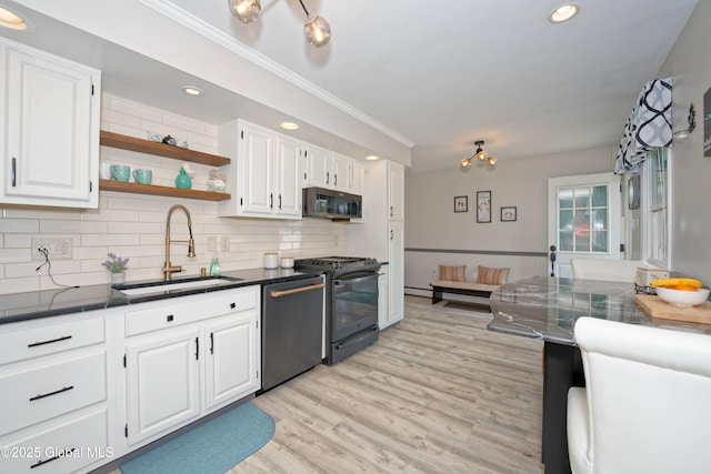 1038 Horvath St, Schenectady, NY 12303 - kitchen featuring stainless steel dishwasher, black range, white cabinets, crown molding, and decorative backsplash
