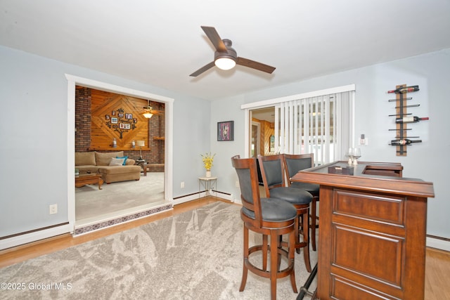 1038 Horvath St, Schenectady, NY 12303 - office space featuring ceiling fan, wood finished floors, a baseboard radiator, baseboard heating, and a dry bar