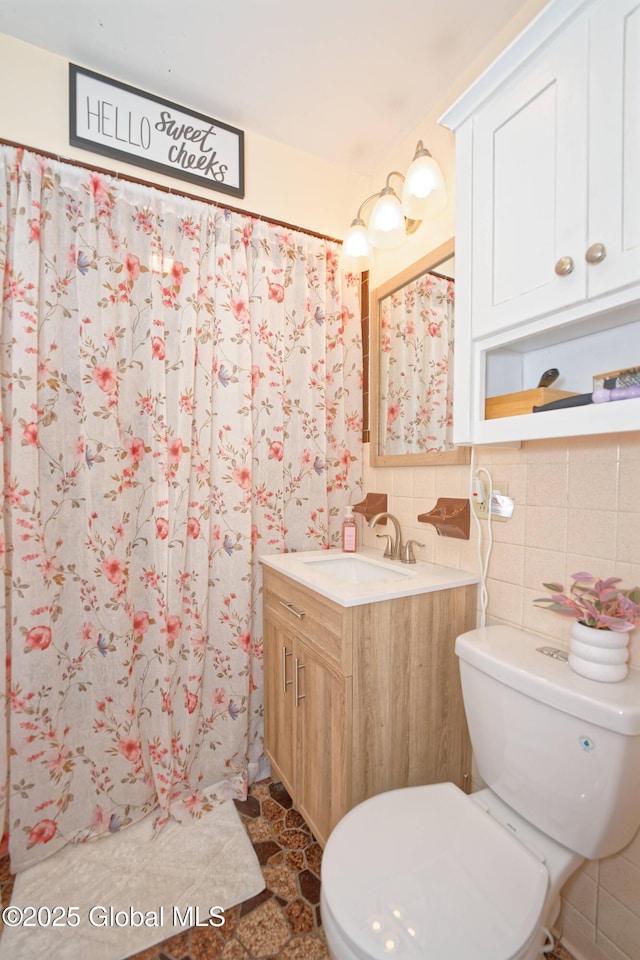 1038 Horvath St, Schenectady, NY 12303 - full bath featuring vanity, tile walls, and a shower with shower curtain