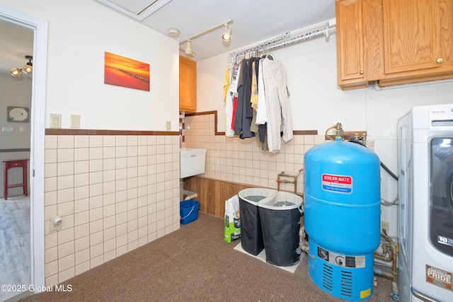 1038 Horvath St, Schenectady, NY 12303 - laundry room featuring washer / clothes dryer, tile walls, cabinet space, a wainscoted wall, and carpet flooring