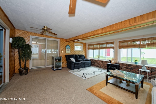 1038 Horvath St, Schenectady, NY 12303 - living room with ceiling fan, wooden walls, carpet floors, and a textured ceiling