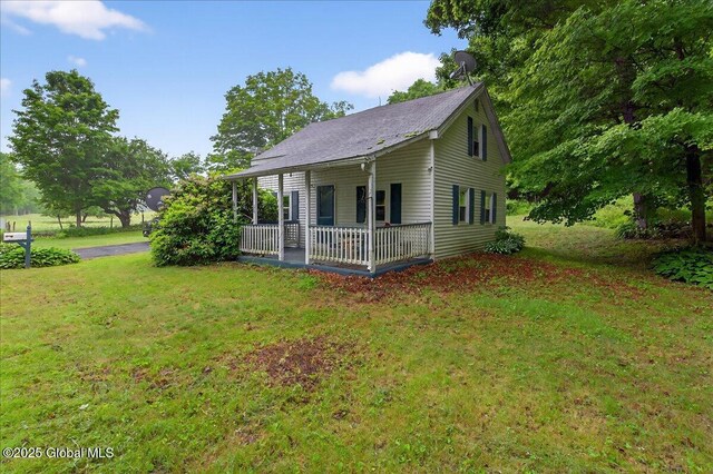 579 Camden Valley Rd, Salem, NY 12873 - view of front of home featuring covered porch and a front lawn