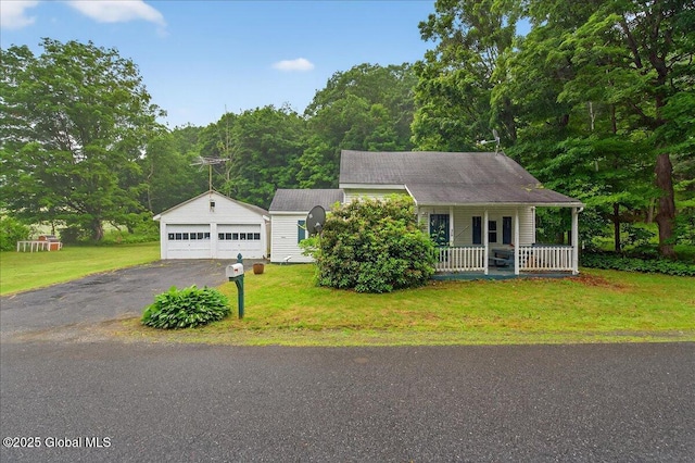 579 Camden Valley Rd, Salem, NY 12873 - view of front of house featuring covered porch, an outdoor structure, a front yard, and a garage