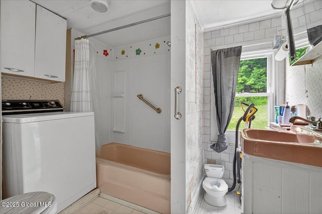 579 Camden Valley Rd, Salem, NY 12873 - bathroom featuring washer / dryer, tile patterned floors, and shower / tub combo