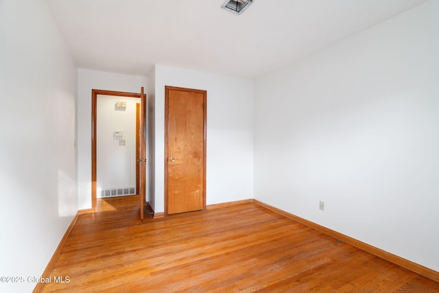 11 Drawbridge Dr, Guilderland, NY 12203 - unfurnished bedroom with light wood-type flooring and a closet