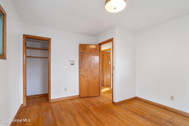 11 Drawbridge Dr, Guilderland, NY 12203 - unfurnished bedroom featuring light wood-type flooring and a closet