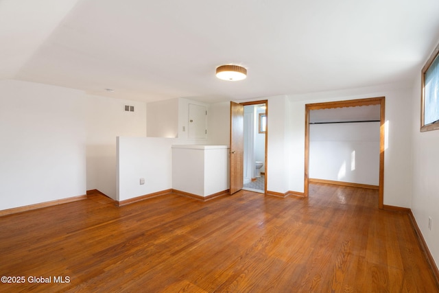 11 Drawbridge Dr, Guilderland, NY 12203 - spare room featuring wood finished floors and baseboards