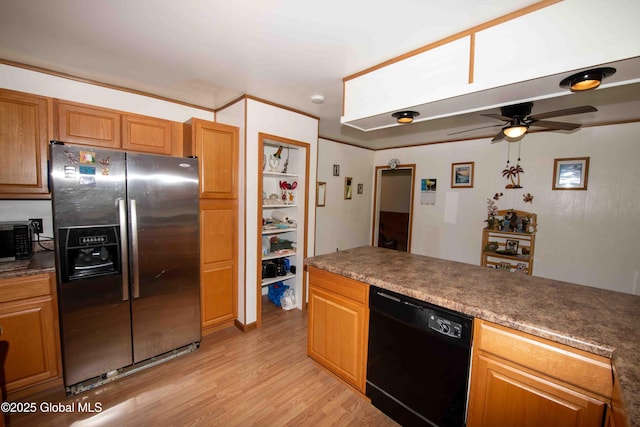 22 Elm Lane Ext, Westerlo, NY 12083 - kitchen with stainless steel fridge, black dishwasher, ceiling fan, light wood-style floors, and brown cabinets