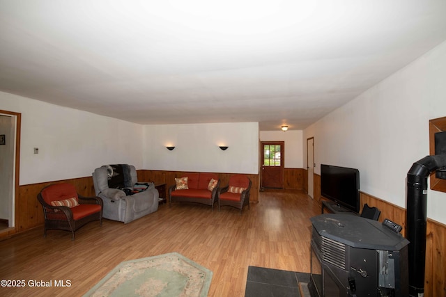 22 Elm Lane Ext, Westerlo, NY 12083 - living room with a wainscoted wall, wood walls, light wood finished floors, and a wood stove