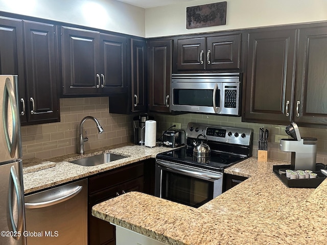 110 Sagamore Rd Unit 6B5, Bolton, NY 12814 - kitchen with appliances with stainless steel finishes, decorative backsplash, and light stone counters