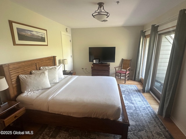 110 Sagamore Rd Unit 6B5, Bolton, NY 12814 - bedroom featuring light wood-style floors and access to exterior