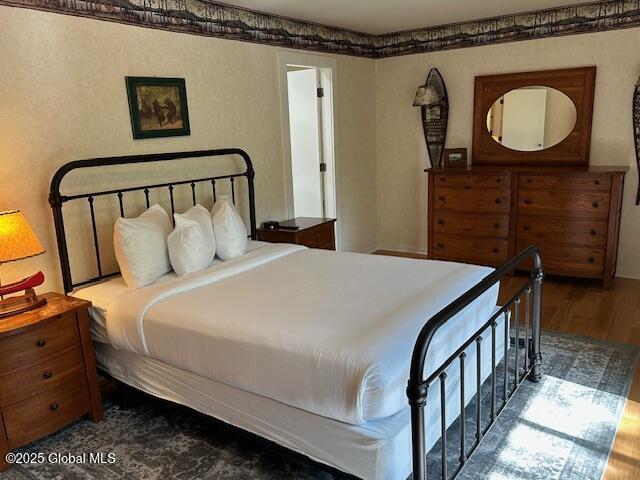 110 Sagamore Rd Unit 6B5, Bolton, NY 12814 - bedroom featuring dark wood-style flooring