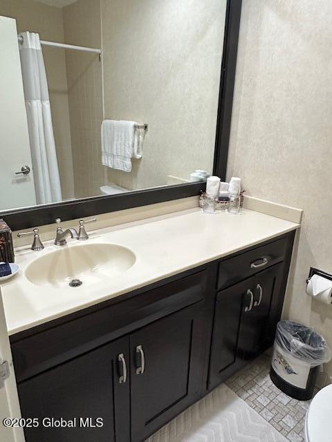 110 Sagamore Rd Unit 6B5, Bolton, NY 12814 - full bath featuring vanity, a shower with curtain, and a textured wall