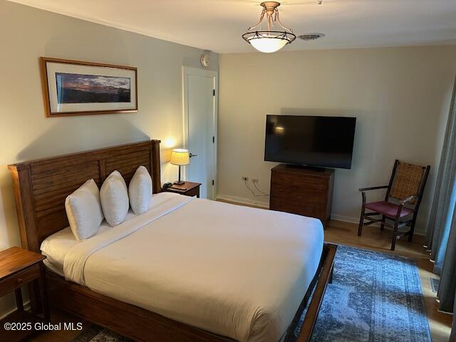 110 Sagamore Rd Unit 6B5, Bolton, NY 12814 - bedroom with wood finished floors and baseboards