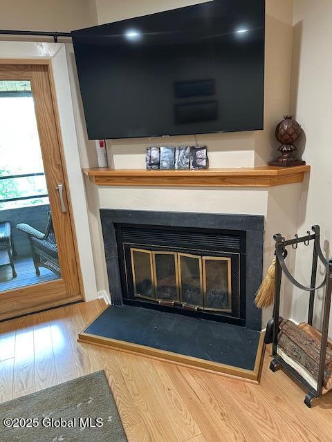 110 Sagamore Rd Unit 6B5, Bolton, NY 12814 - detailed view of a glass covered fireplace and wood finished floors