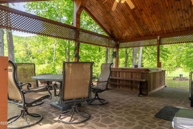 249 Old Saratoga Rd, Moreau, NY 12831 - sunroom featuring outdoor dining area, a jacuzzi, a ceiling fan, and vaulted ceiling