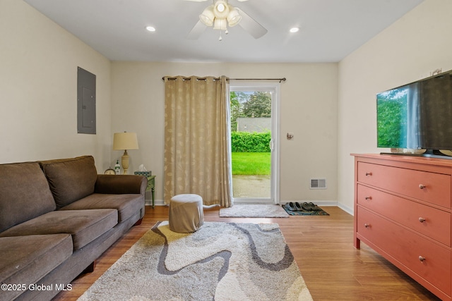 1148 Outer Dr, Rotterdam, NY 12303 - living area featuring electric panel, light wood-style flooring, a ceiling fan, and recessed lighting