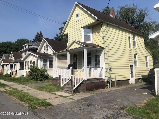 127 N Toll St, Scotia, NY 12302 - view of front facade with a chimney and a porch