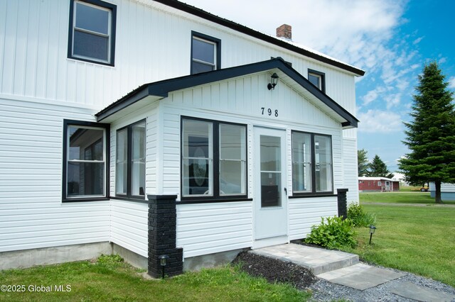 798 State Highway 29, Broadalbin, NY 12025 - view of property exterior with a chimney, a yard, and a sunroom