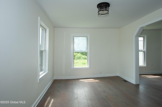 798 State Highway 29, Broadalbin, NY 12025 - spare room featuring healthy amount of natural light, dark wood finished floors, and arched walkways